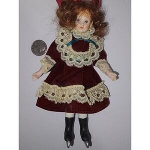 Vintage China Doll in‎ Red Velvet and ice skates